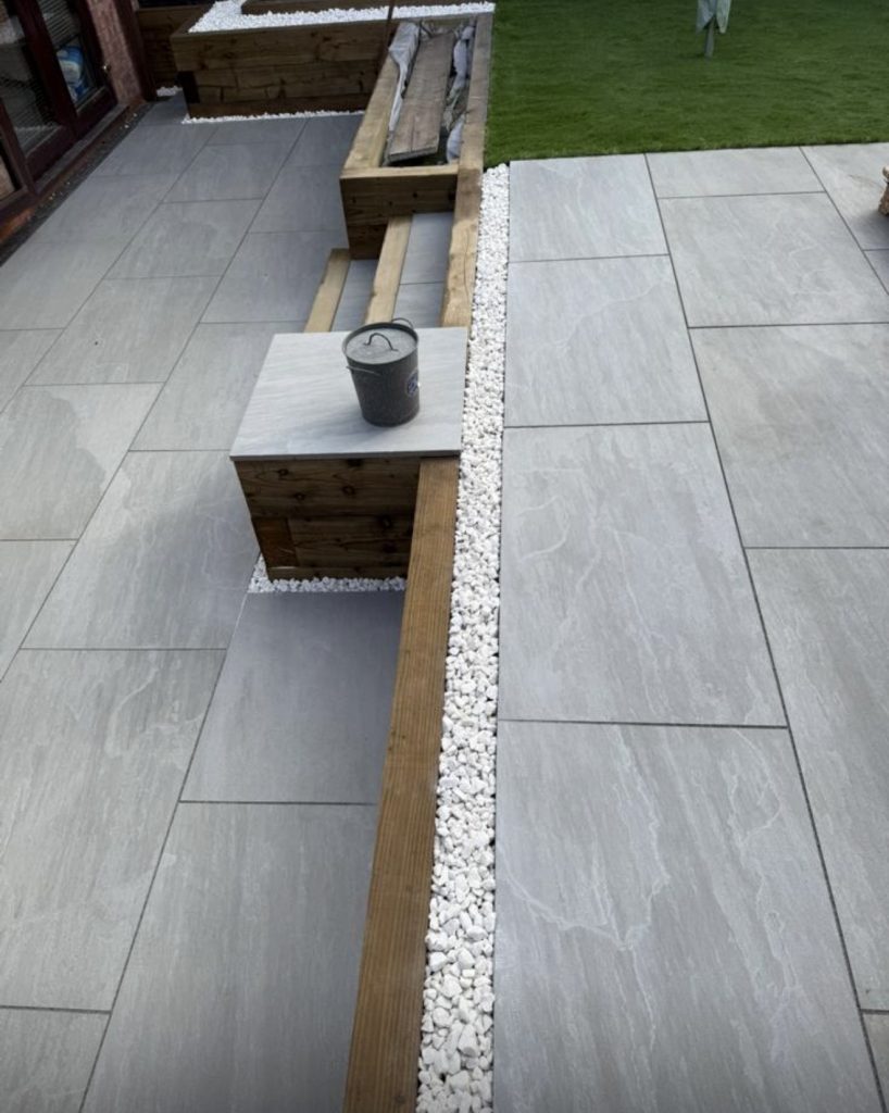 Garden makeover using hard and soft landscaping making porcelain paving a foul point.